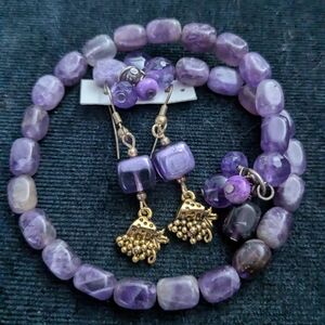 Purple beaded earrings and bracelet set.